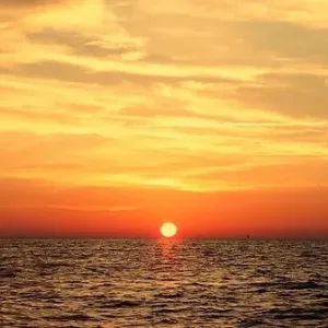 Boat cruising at sunset along North Shore