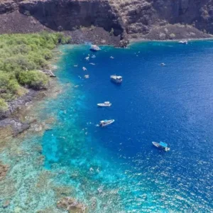 Private boat cruising on calm ocean waters