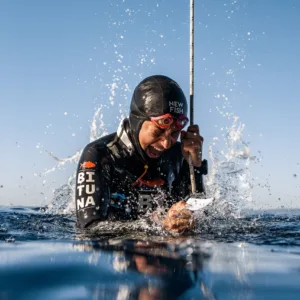 Scuba diving instructor teaching course in clear ocean waters