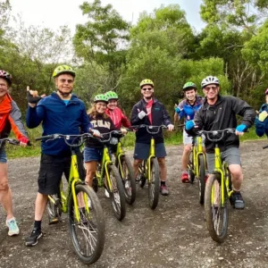 Cyclists riding downhill through Waimea Canyon scenic trail