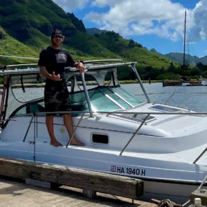 Private charter boat sailing near Kauai shore