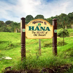 Luxury vehicle driving along scenic Road to Hana coastline
