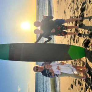 Group enjoying surf lessons on Maui beach
