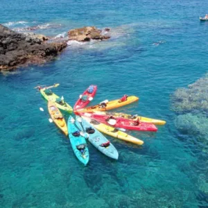 Exploring the sea cave by kayak at Keahou Bay