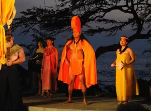 Couple seated in premium area enjoying Hawaiian luau show