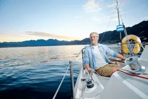 Sailboat navigating along coastal waters during cruising lesson