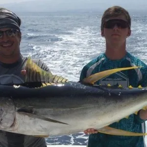 Angler casting fishing line from private boat