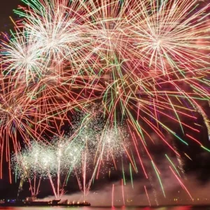 Public cruise enjoying sunset views and fireworks display