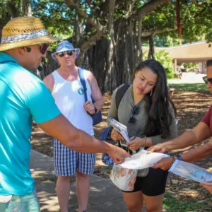 People enjoying a walk through lush Kapi'olani Park trails