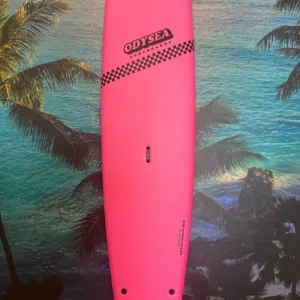 Pink 9 foot Odysea surfboard leaning against palm tree