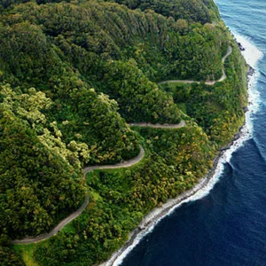 Adventure vehicle driving along lush Road to Hana