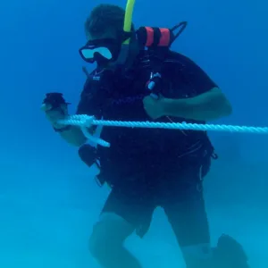 Advanced open water divers exploring deeper ocean areas