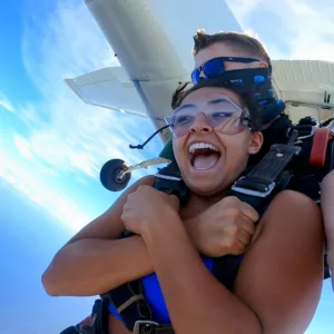 Skydiver freefalling over scenic Kohala Coast Big Island