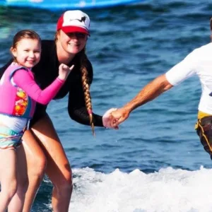 Instructor teaching private surf lesson on Kona coast