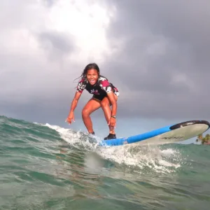 Surf instructor giving private lesson to individual surfer