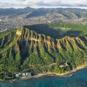 Shuttle bus heading towards Diamond Head crater at sunrise