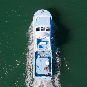 Passengers relaxing on a shared charter boat near Kauai island