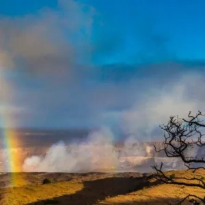 Hikers walking through volcanic landscape in Hawaii park