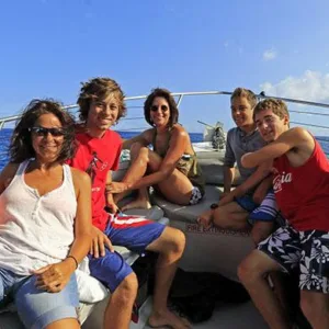 Private boat charter anchored near coral reef