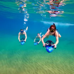 Snorkeler riding sea scooter near Wailea Beach