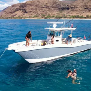 Snorkelers observing vibrant marine life near Ko Olina