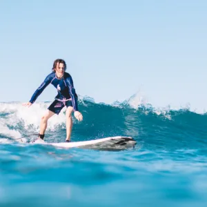 Beginner surf lessons on gentle island waves