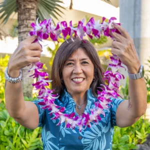 Fresh orchid lei ready for greeting guests
