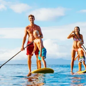 Person paddling stand-up paddleboard on calm water