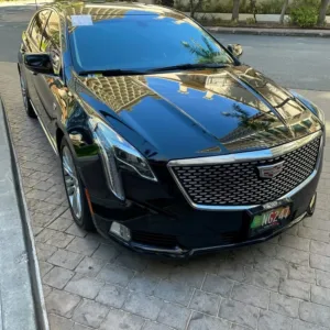 Luxury sedan parked at Ko Olina resort entrance