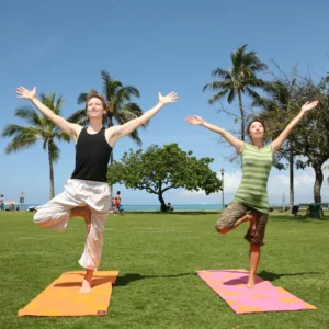Family practicing yoga together in private studio