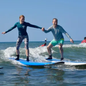 Surf instructor teaching basics on the beach