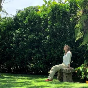 Person walking mindfully through artist’s garden
