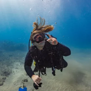 Scuba diving student practicing skills in calm shore waters