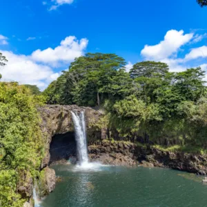 Waterfall cascading in lush Big Island rainforest