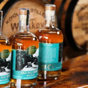 Exterior of Ko‘olau Distillery nestled in green foothills
