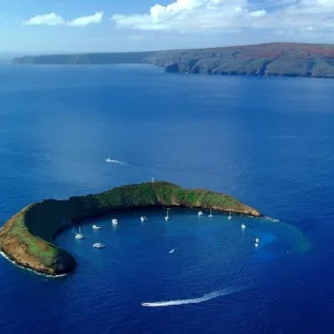 Snorkelers exploring clear waters near Molokini crater