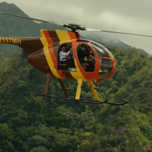 Helicopter flying over Honolulu and Diamond Head