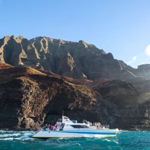 Sunset view over Kauai coastline from boat