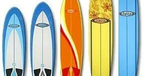 Person renting a surfboard on a sunny beach