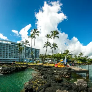 Kayakers exploring historic Hilo Bay and nearby waterfalls