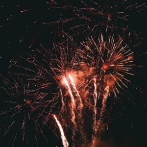 Fireworks lighting up sky over Waikiki beach at night