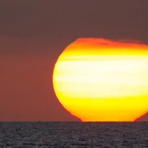 Adults sailing at sunset near Ma'alaea harbor