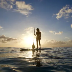 Person learning paddling basics on calm water