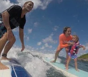 Instructor giving private surf lessons in Maui waters