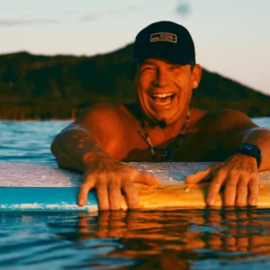 Surf instructor guiding student during 60 minute lesson