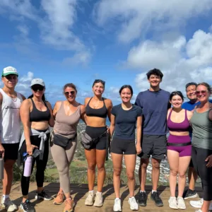 Hiker ascending Koko Head Crater Trail with ocean views