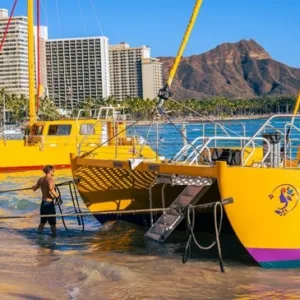 Sailboat cruising near Diamond Head in Waikiki