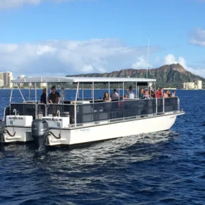 Catamaran cruising under Waikiki fireworks at night
