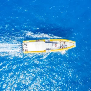 Snorkelers exploring coral reefs from custom raft