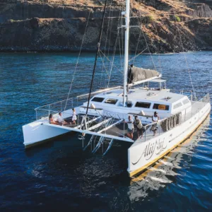 Sailing catamaran cruising near Molokini crater